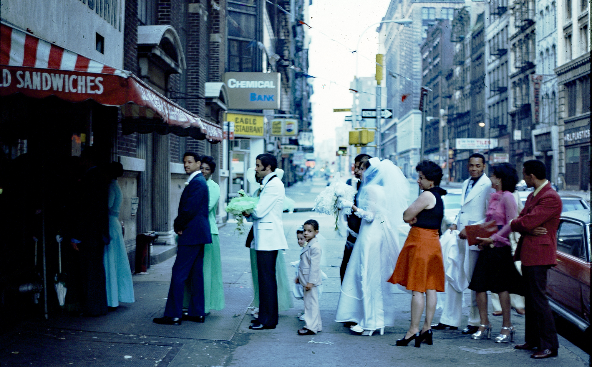 Wedding party entering a restaurant on Broadway near Spring, 1975