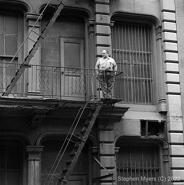 Henry Zeisel on Fire Escape ca. 1970 (© Stephen Myers)