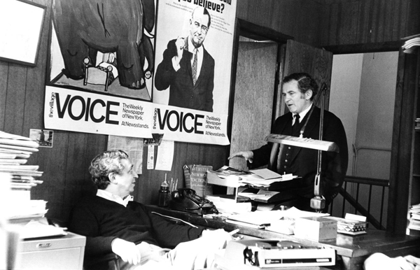 Norman Mailer, who co-founded of The Village Voice, with Dan Wolf in the newspaper’s office