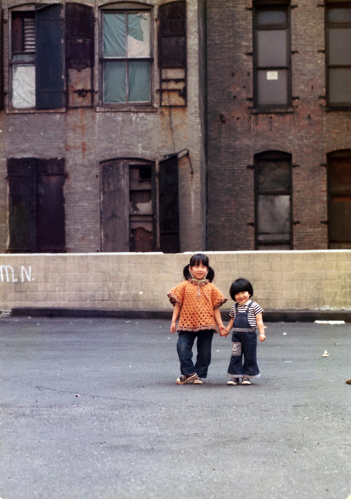 This photo of me and my sister was taken in 1974 in the parking lot on Crosby Street between Prince and Spring, the current site of the Crosby Hotel, where we would often play.