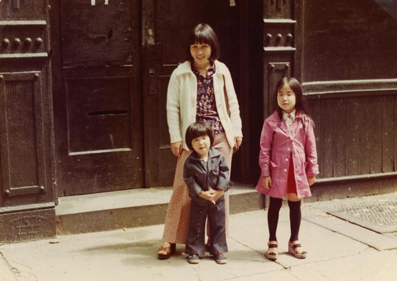My mom, my sister, and me standing in front of our building on Crosby Street, ca. 1975