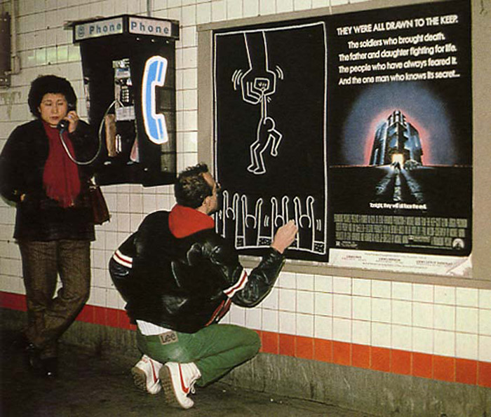 Keith Haring drawing in a subway station.